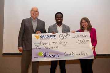 The Three-Minute Thesis winners hold a large check.