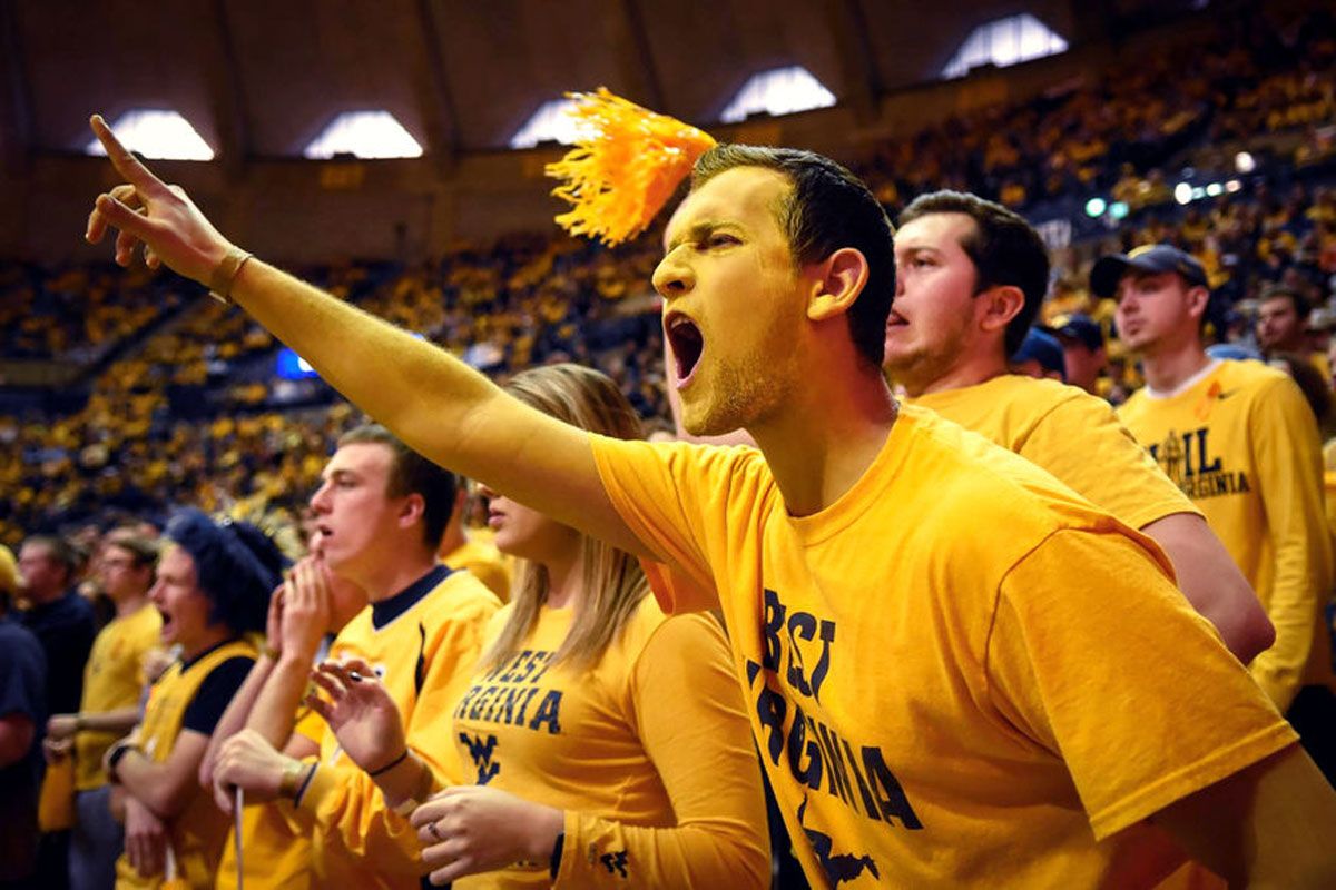 Mountaineer fans screaming in the stands.