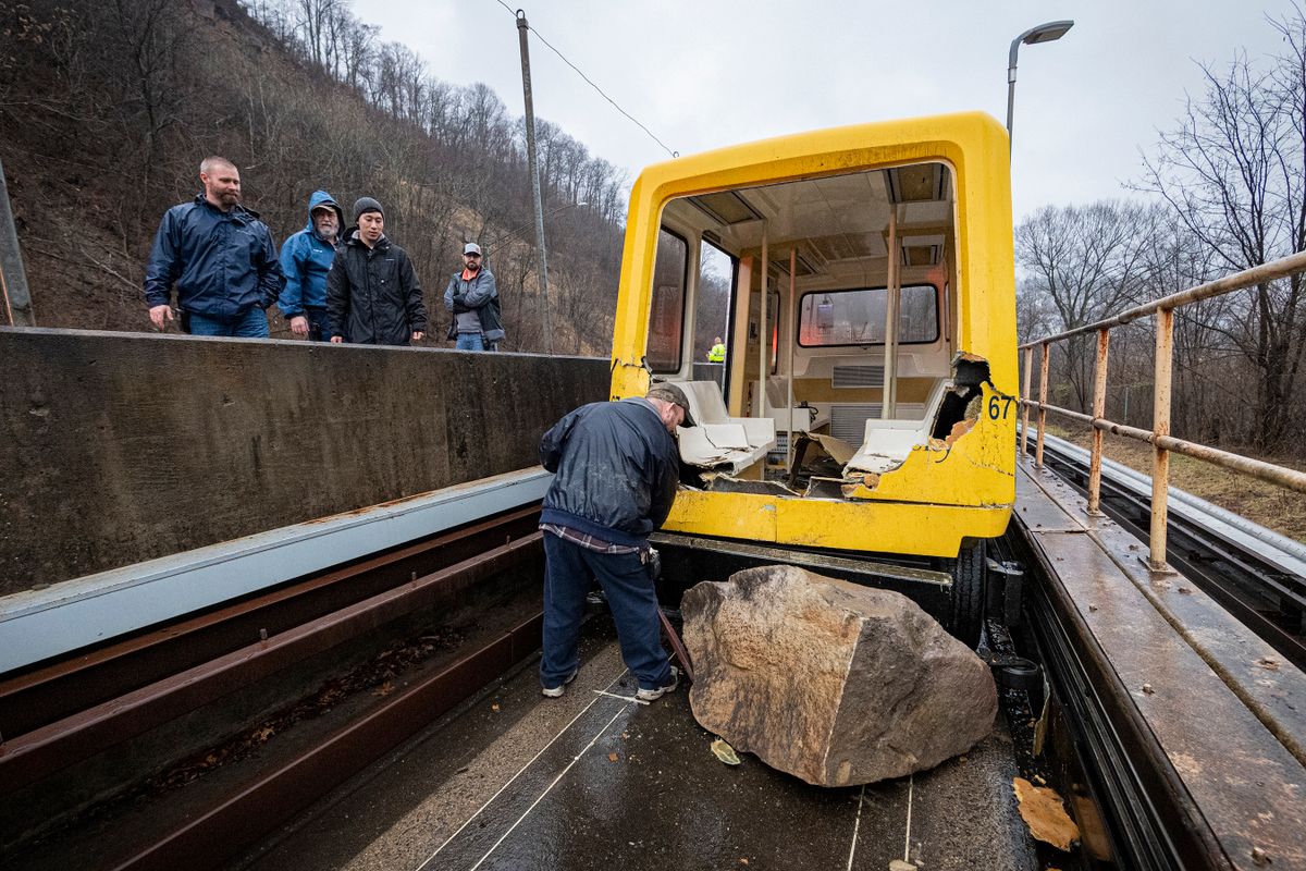 PRT car and workers on the tracks