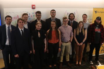 Students from teams competing in the 2019 March Idea Challenge stand together