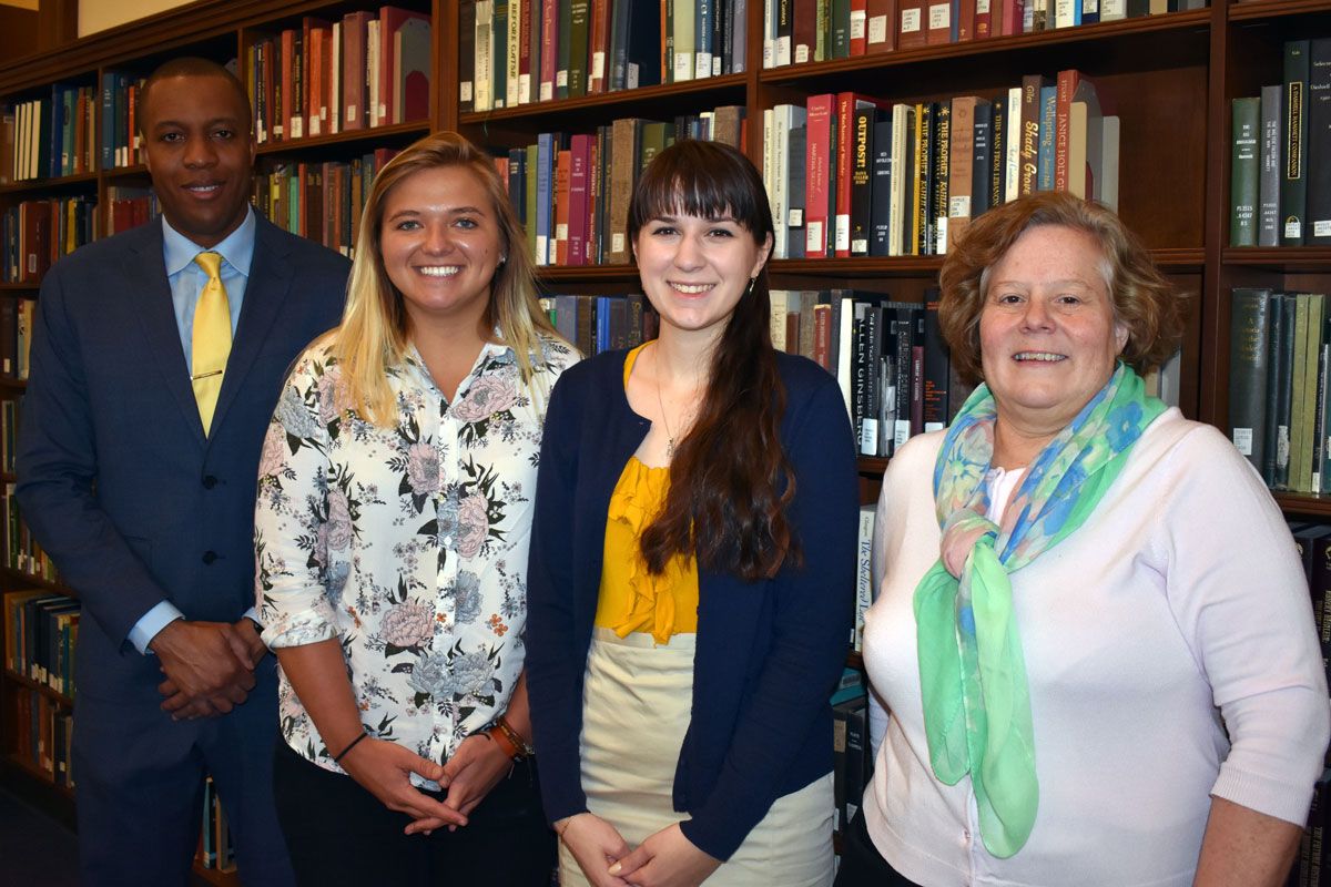 Munn Award winners Rachel A. Wattick (second from left) and Elizabeth Satterfield pose with Damien Clement, assistant dean of the Honors College, and Karen Diaz, interim dean of WVU Libraries.