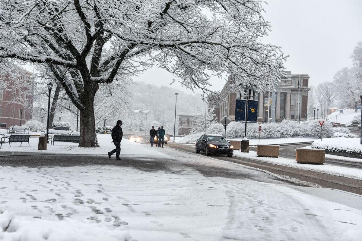 Students walk on snow covered WVU campus in Morgantown.