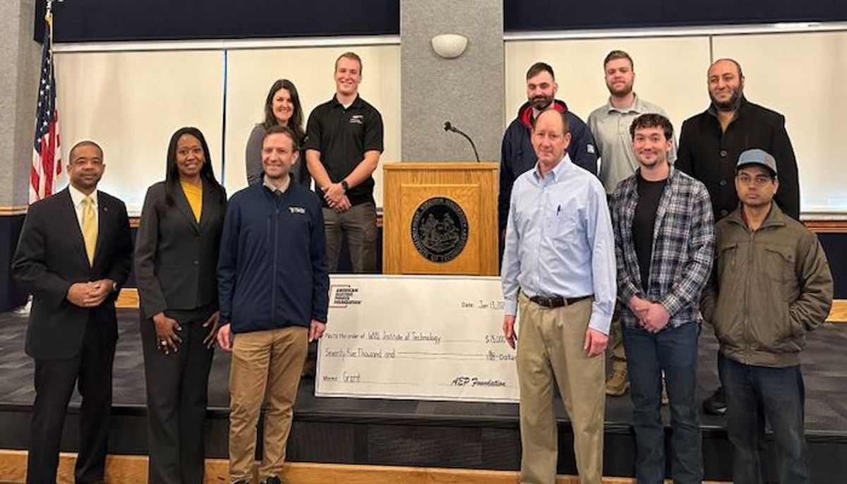 WVU Tech staff and students holding large check 