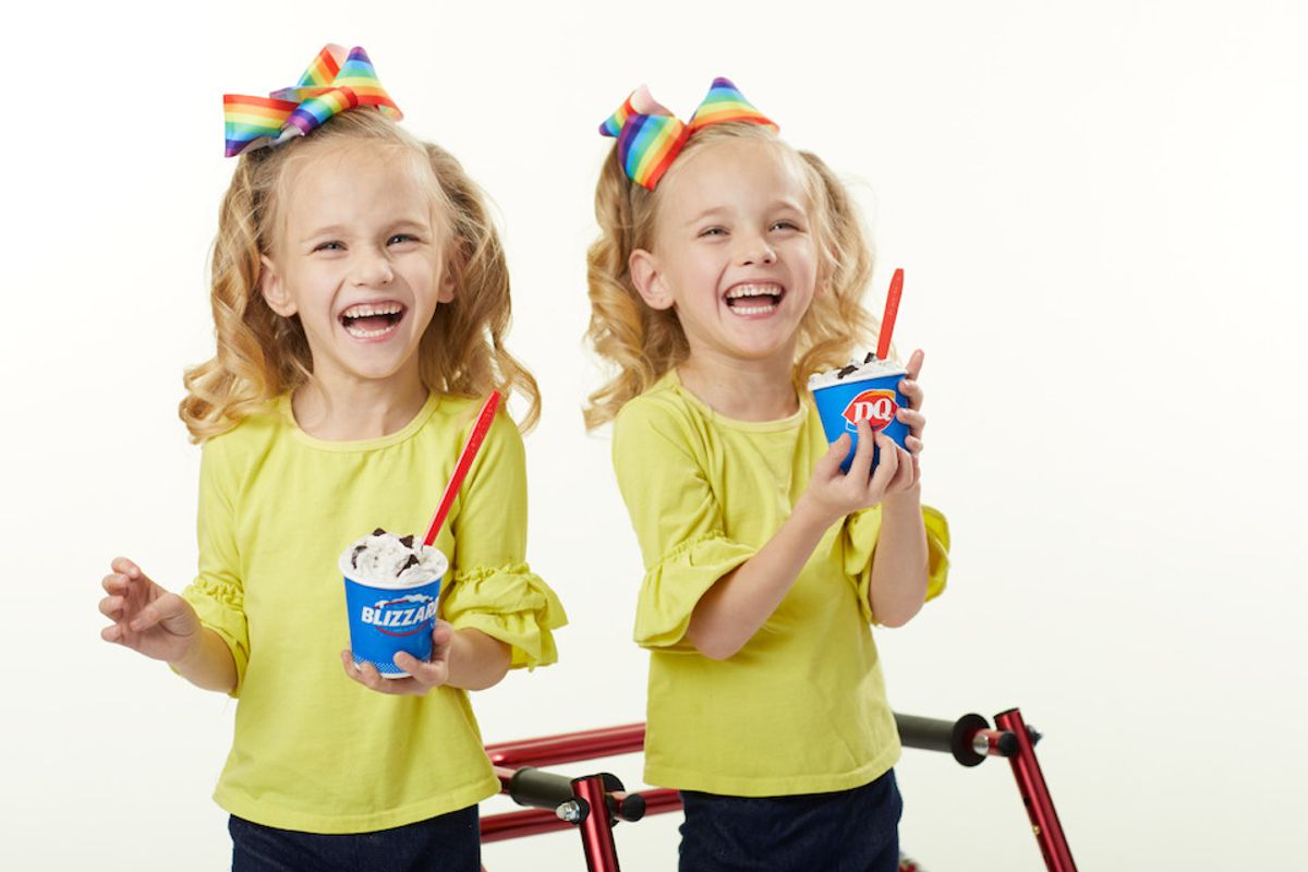 Twin girls eating ice cream