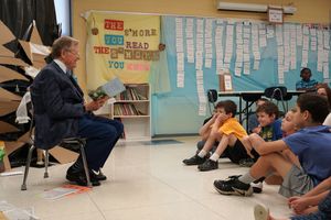 President Gordon Gee reads to school kids