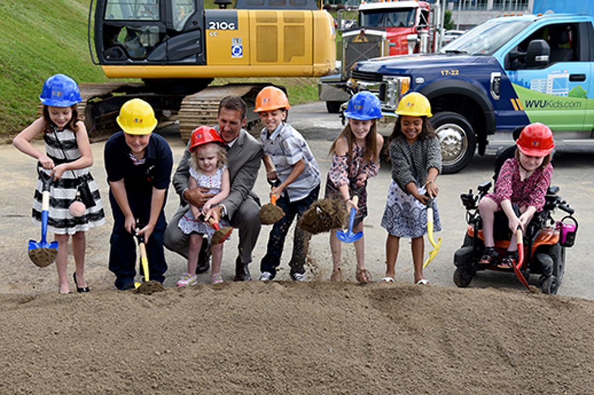 A group of young children breaking ground at the WVU Childrens hospital site.